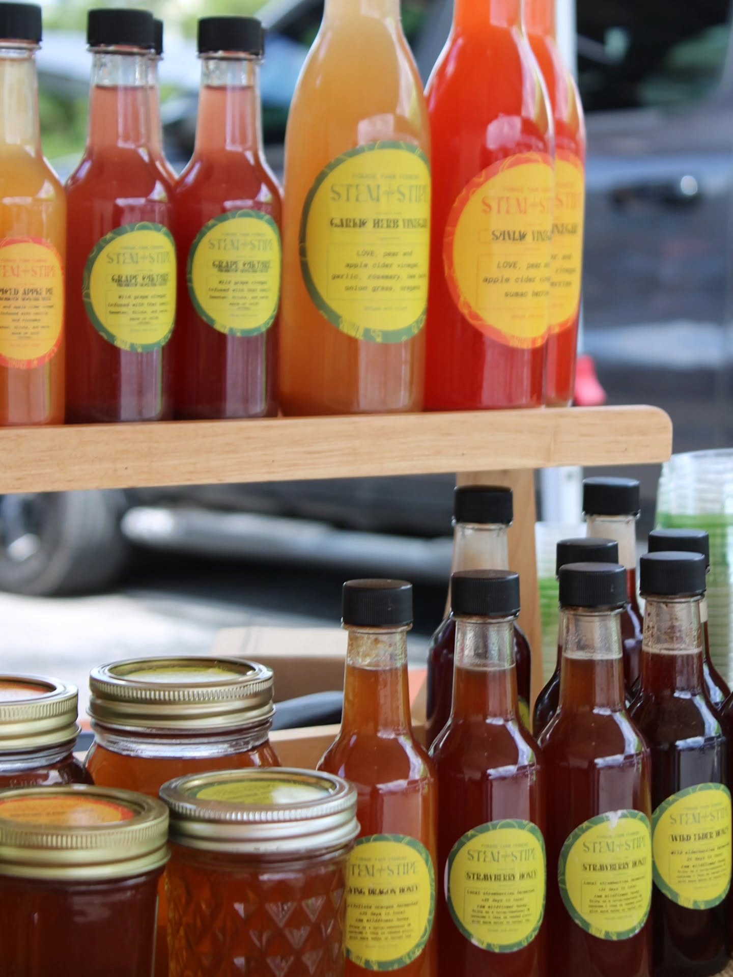 Stem + Stipe honey and vinegar bottles on display